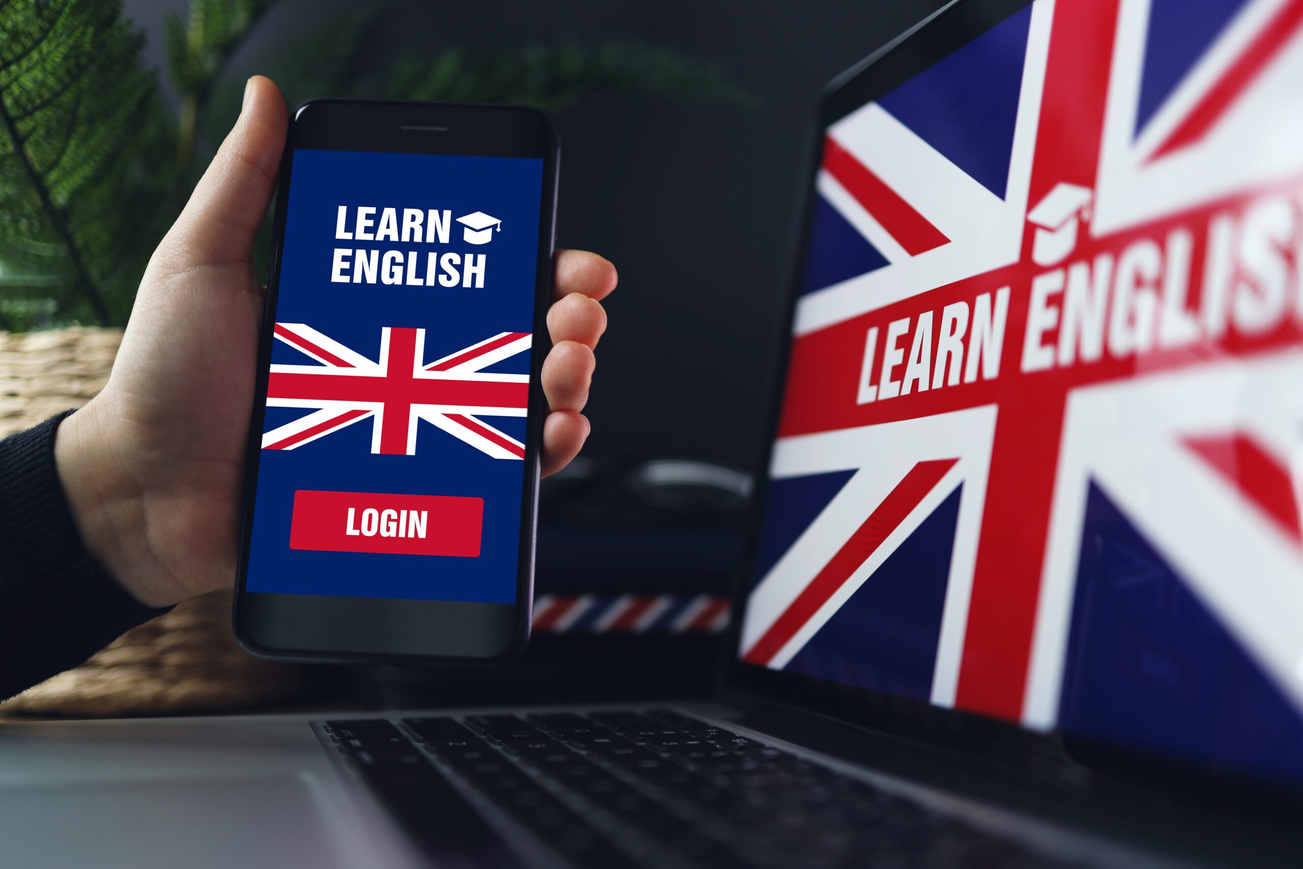 learning-foreign-languages-online-holding-smartphone-with-app-studying-english-min